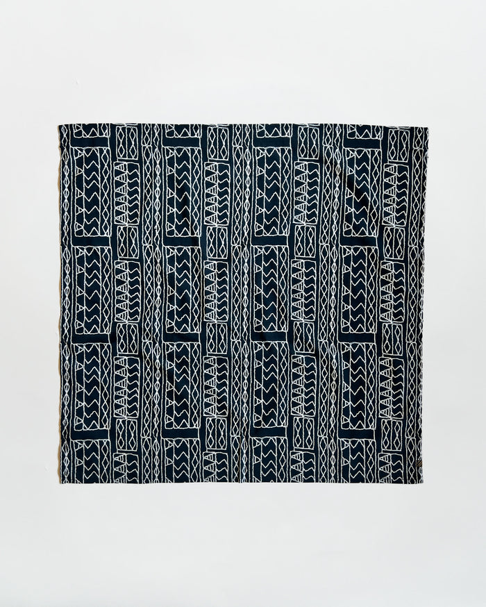 Black and white patterned fabric on a light gray background