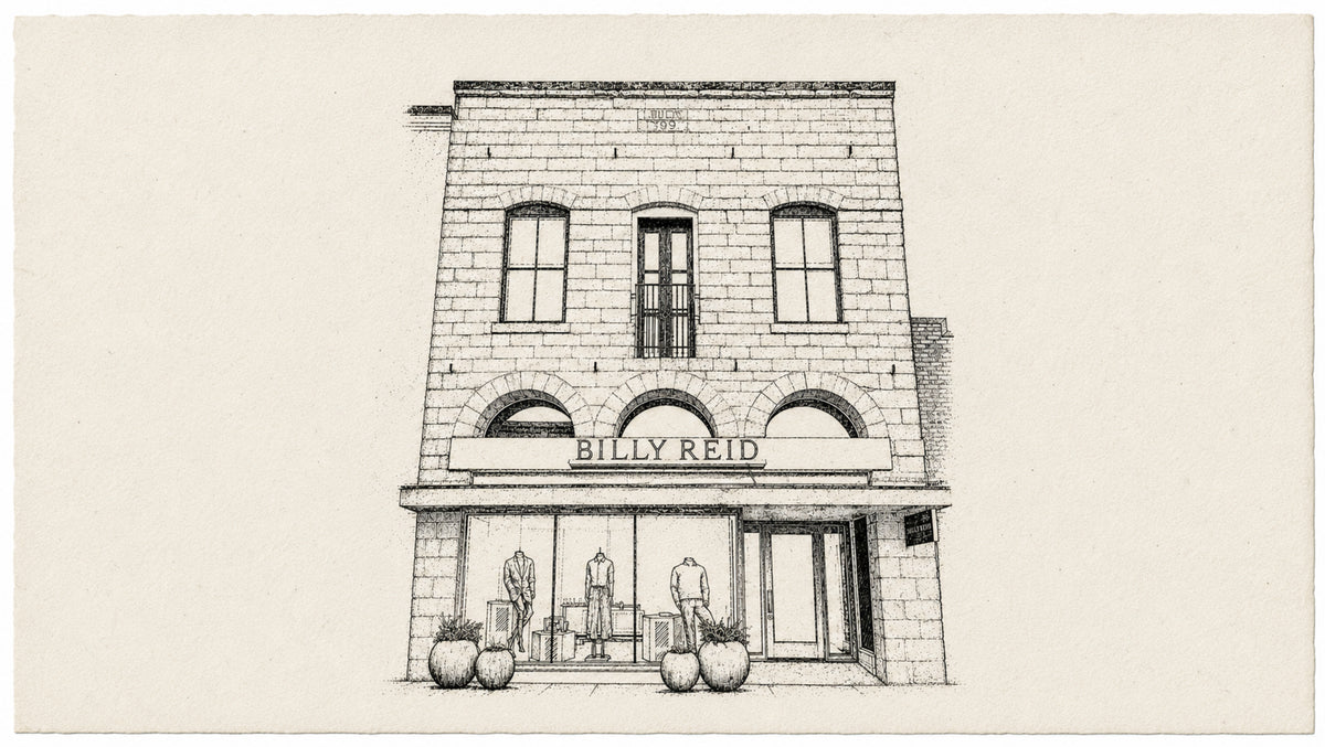 A black and white architectural sketch of a brick storefront building with the name 'BILLY REID' above the entrance, shown on a plain light background.