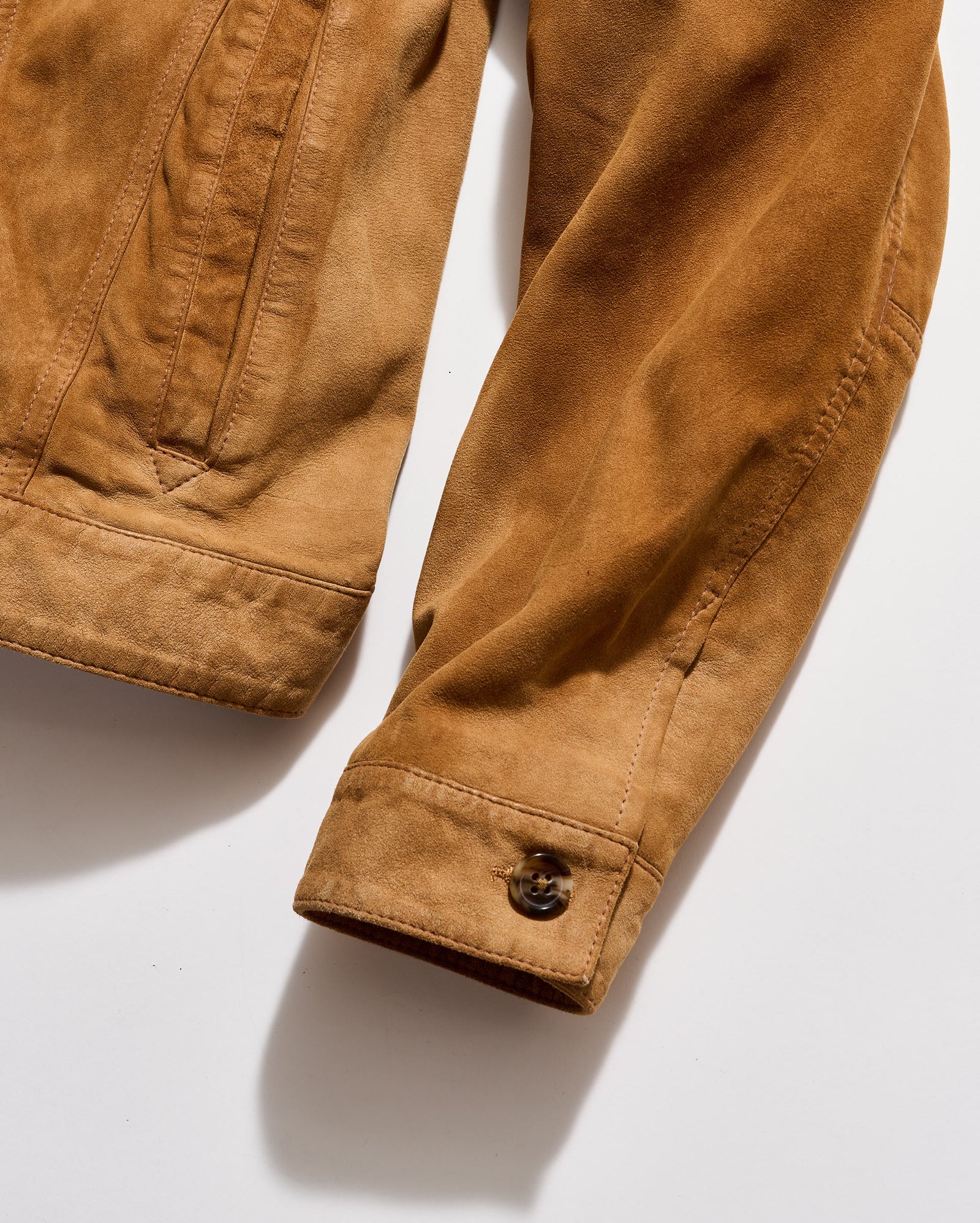 Brown jacket sleeve on a white background