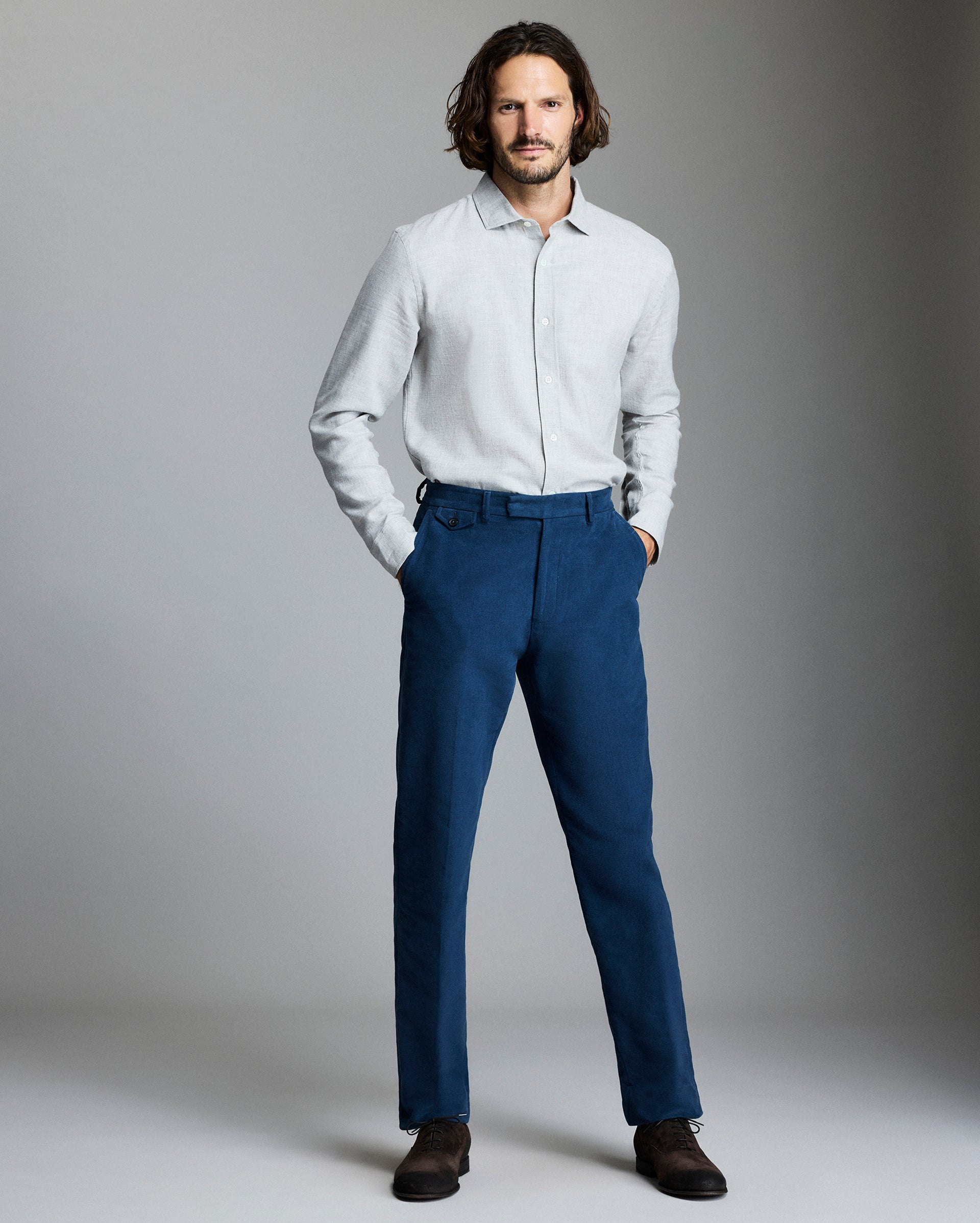 Model wears the Moleskin Flat Front Trouser in Denim Blue