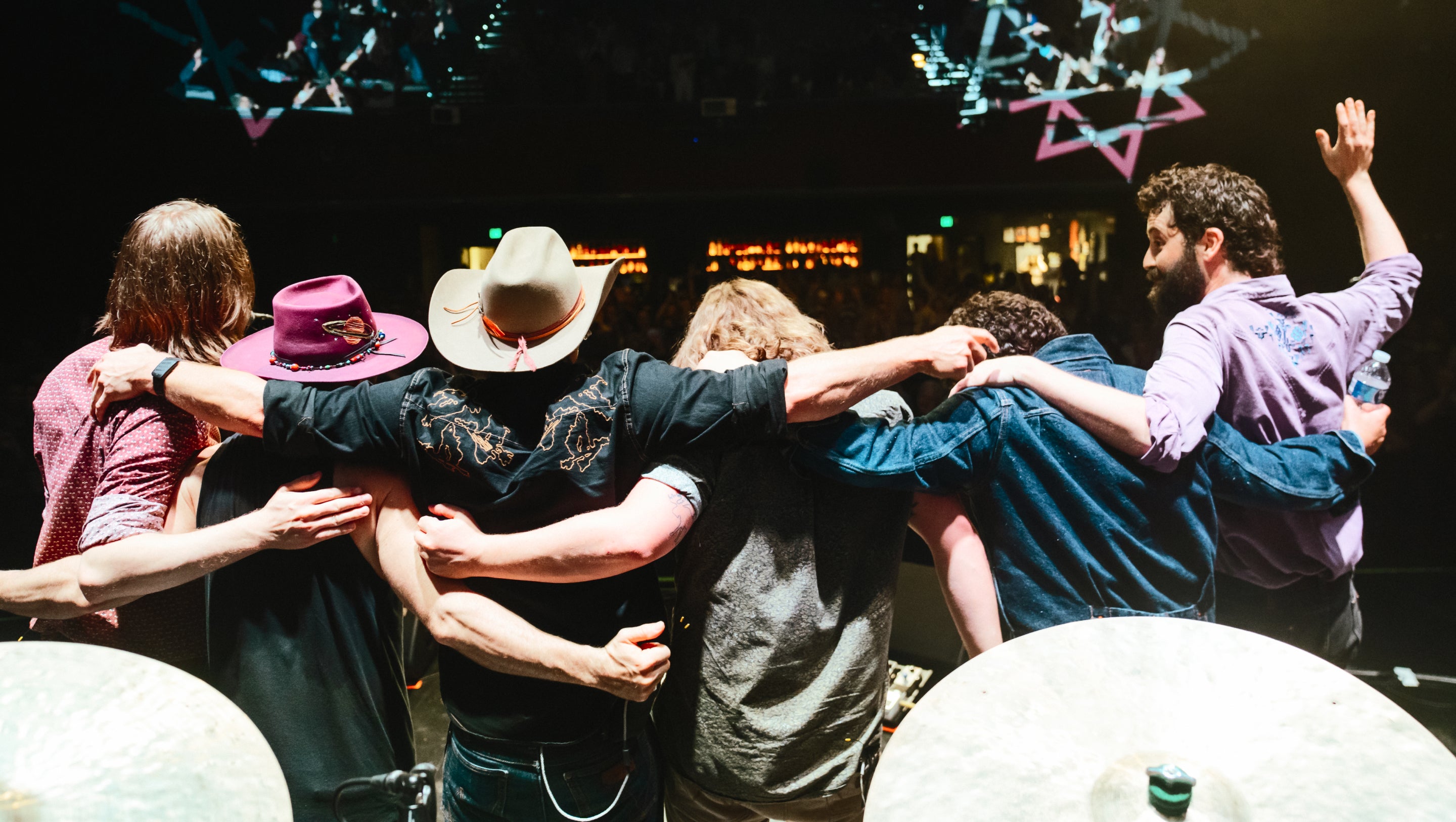 People hugging on stage.