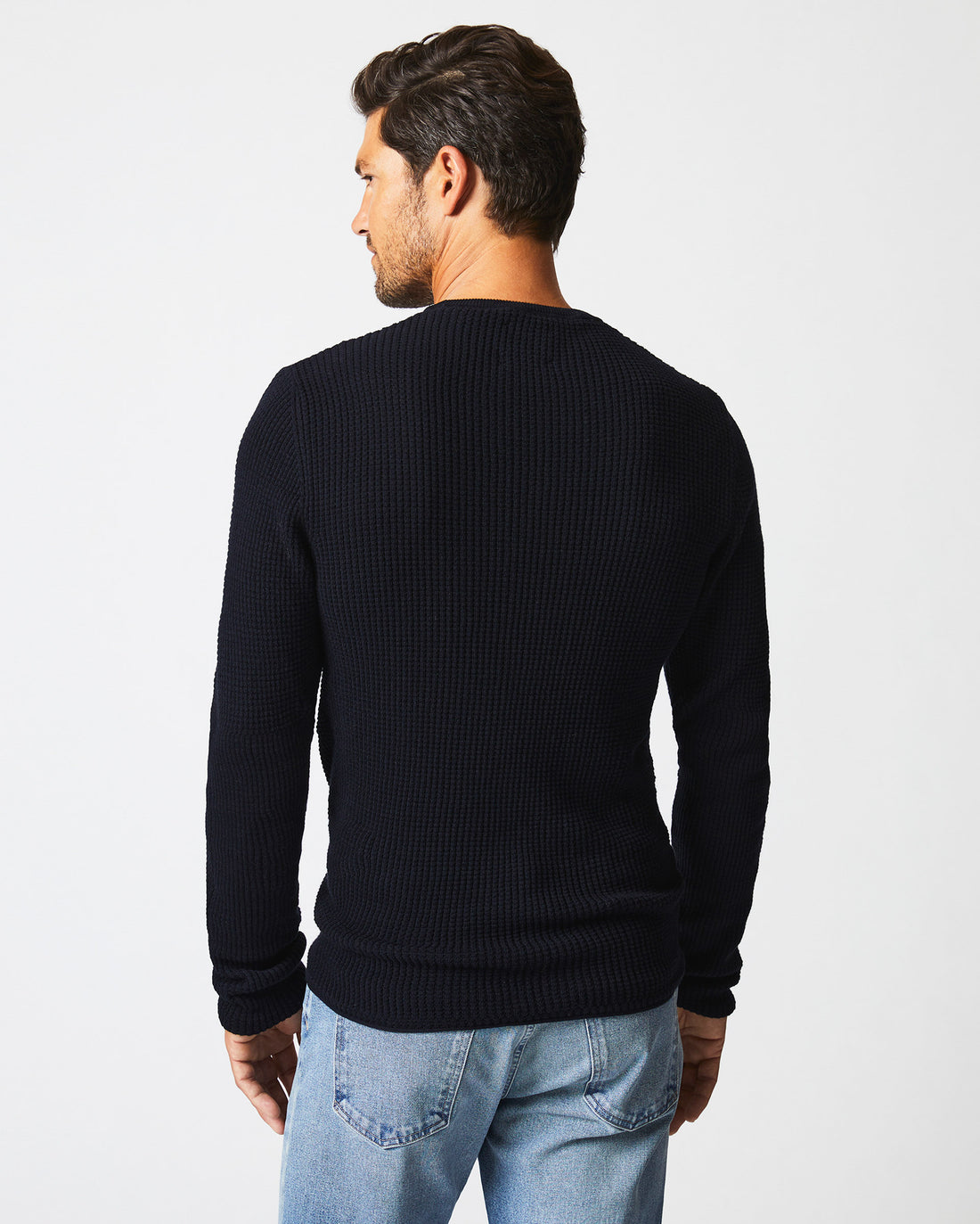 Male model wears the Mini Waffle Crew in Midnight