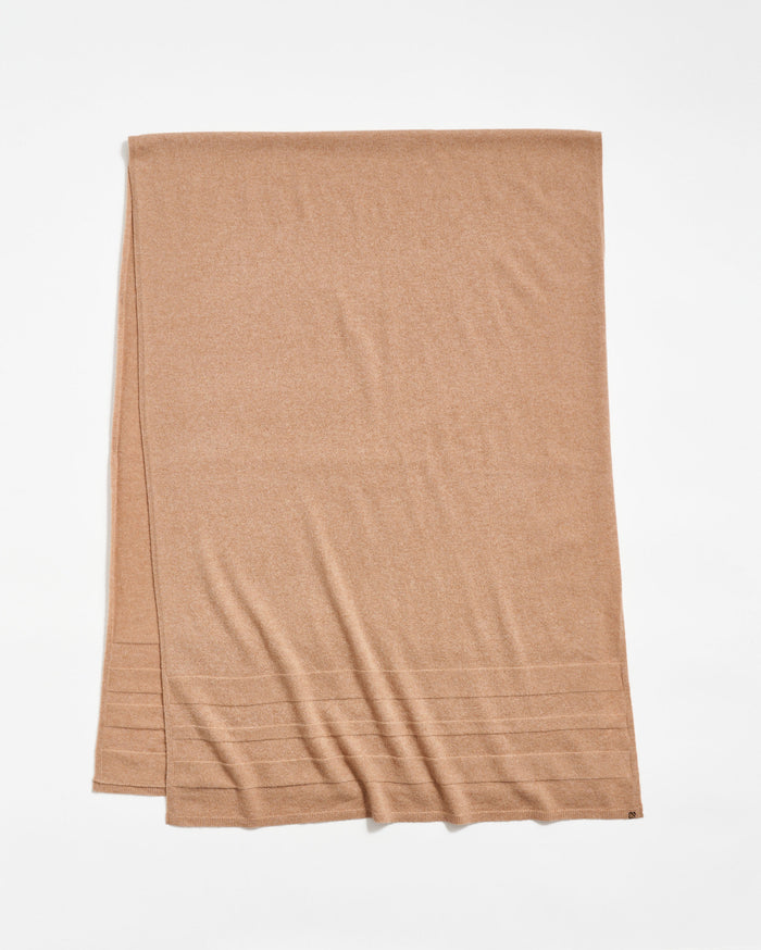 A light brown rectangular scarf is laid flat on a white background, featuring subtle horizontal ribbed lines near one end.