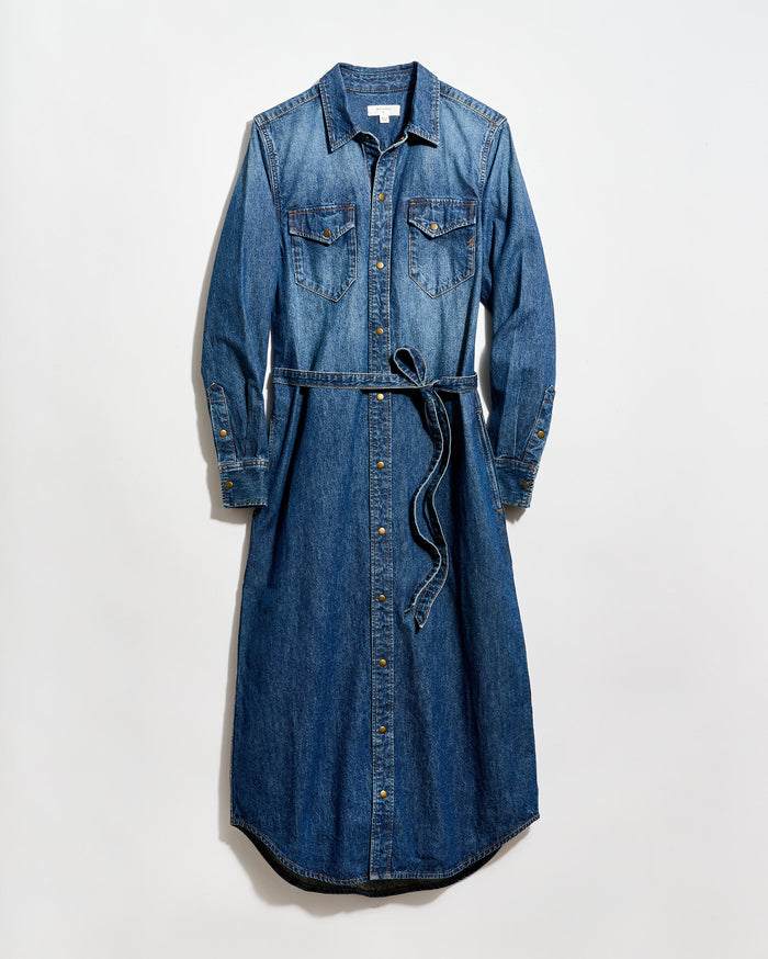 A long-sleeve, button-down denim dress with a collar, two chest pockets, and a matching denim waist tie, laid flat on a white background.