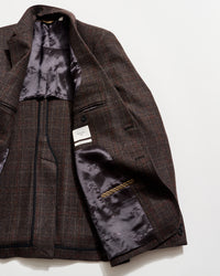Brown checkered jacket with floral lining on a white background