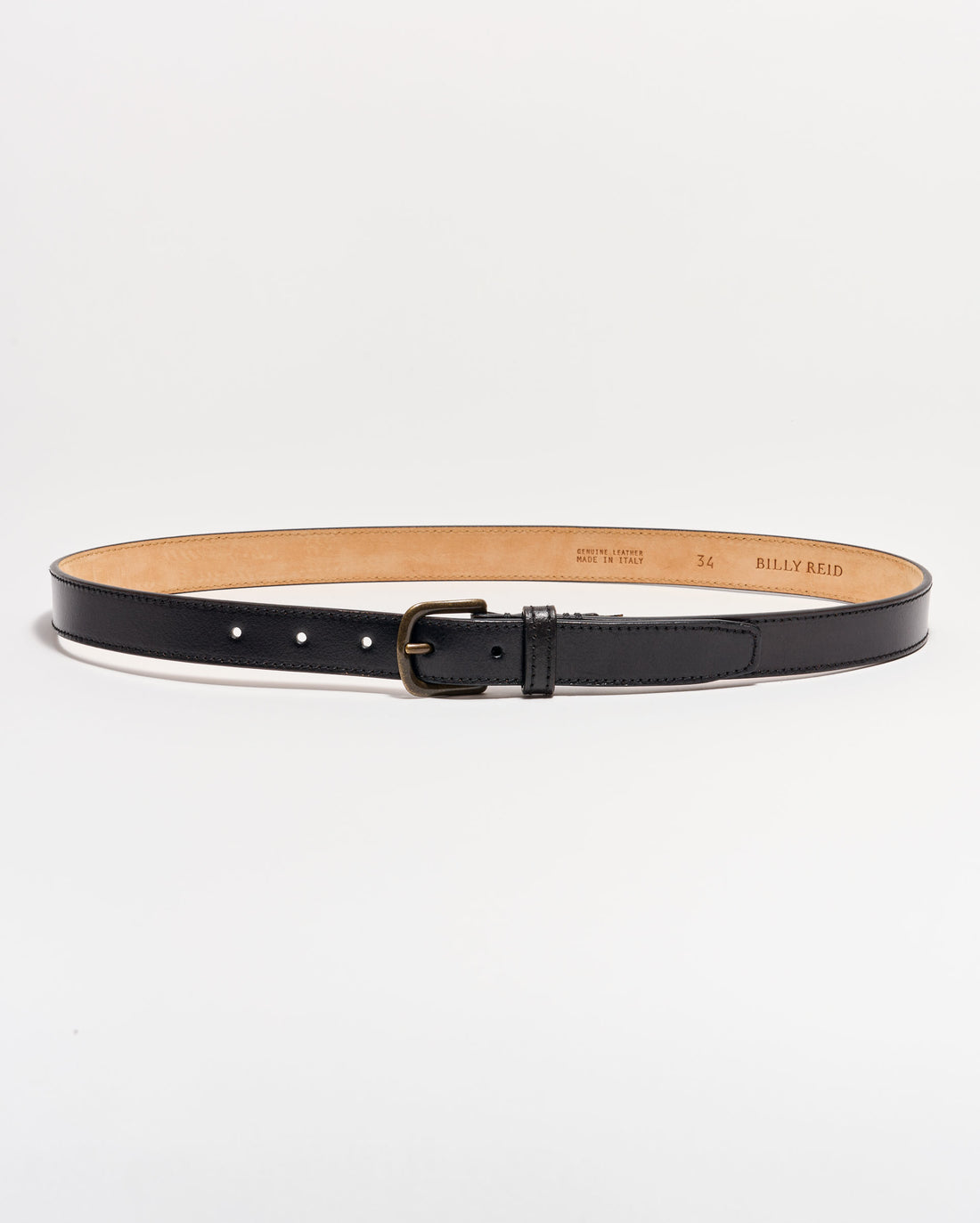 A black leather belt with a matte silver buckle is laid flat on a white background. The belt interior is tan, and size and brand details are stamped on the inside.