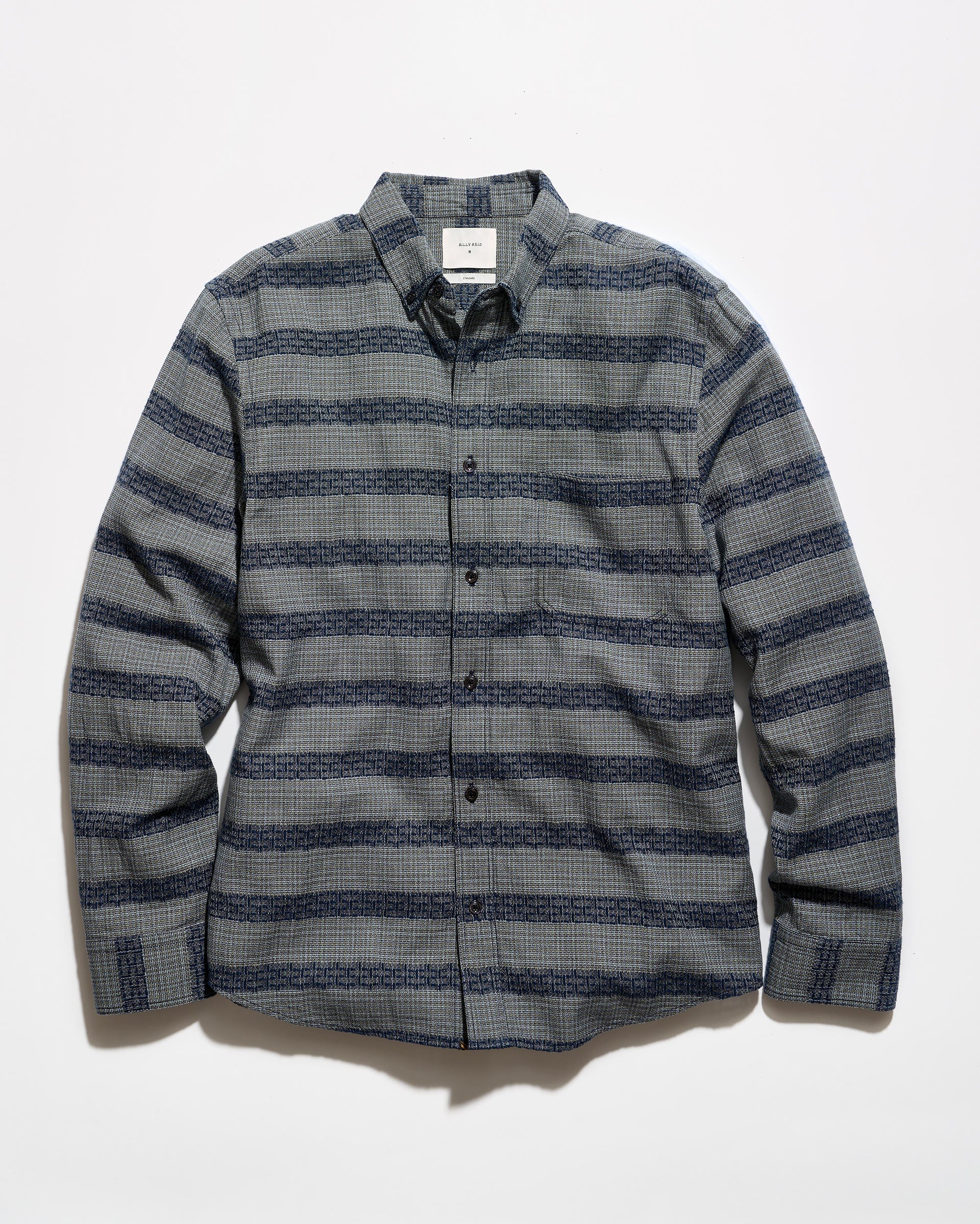 A long-sleeve button-up shirt with a textured gray and navy blue horizontal stripe pattern, laid flat against a white background.