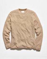 A beige ribbed long-sleeve crewneck sweater laid flat against a clean white background.