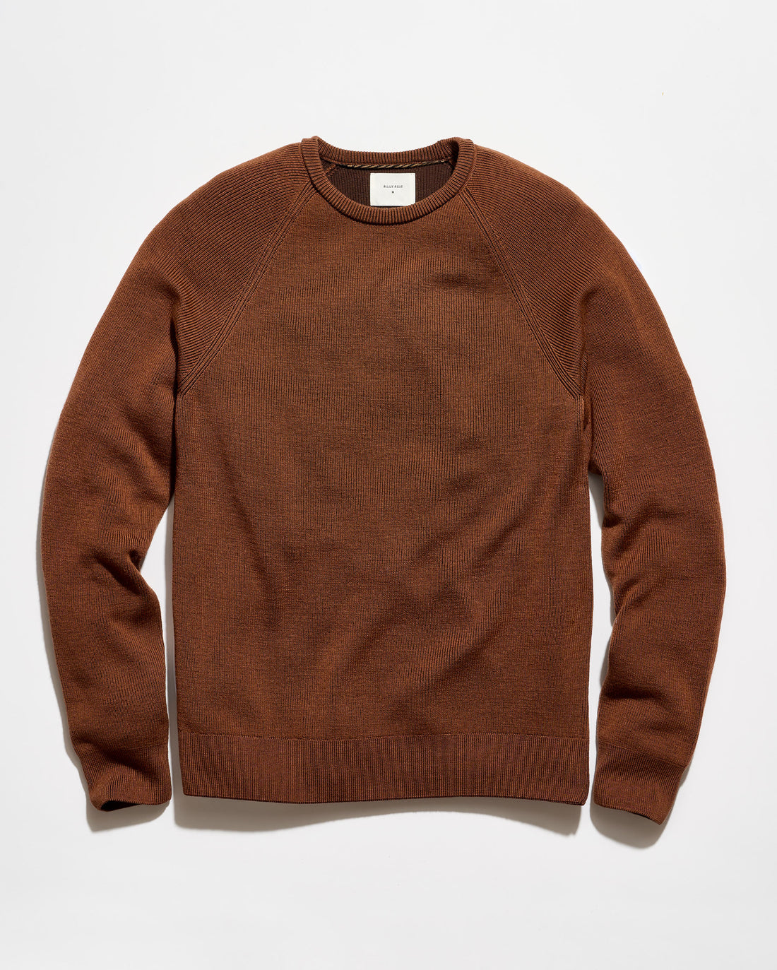 A brown crewneck knit sweater with raglan sleeves, laid flat against a clean white background.