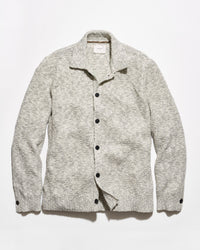 A light gray and white heathered knit cardigan sweater with a collar and dark buttons, laid flat against a white background.