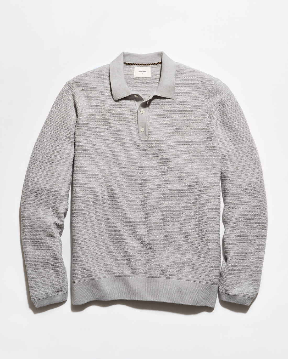 A light gray ribbed knit polo sweater with a collar and three-button placket, laid flat against a white background.