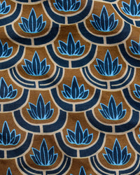A close-up of a patterned fabric featuring a repeating Art Deco style design with blue lotus flowers and scalloped arches on a warm brown background.