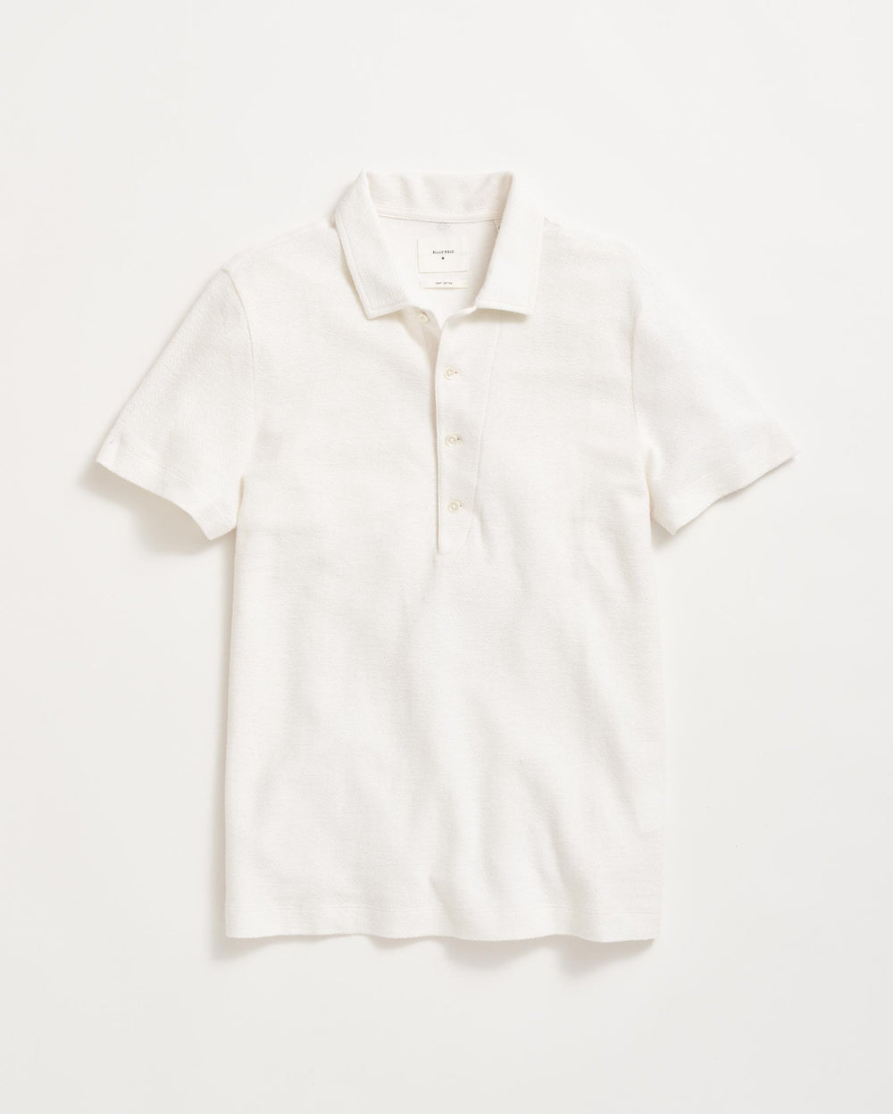 A plain white short-sleeve polo shirt with a collar and three buttons, laid flat on a white background.