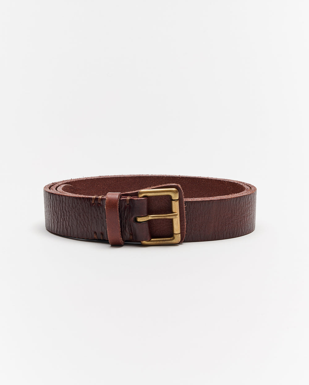 A coiled brown leather belt with a brass buckle, displayed against a plain white background.