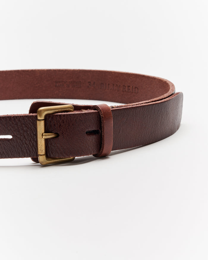 A close-up of a brown leather belt with a brass buckle displayed against a plain white background.