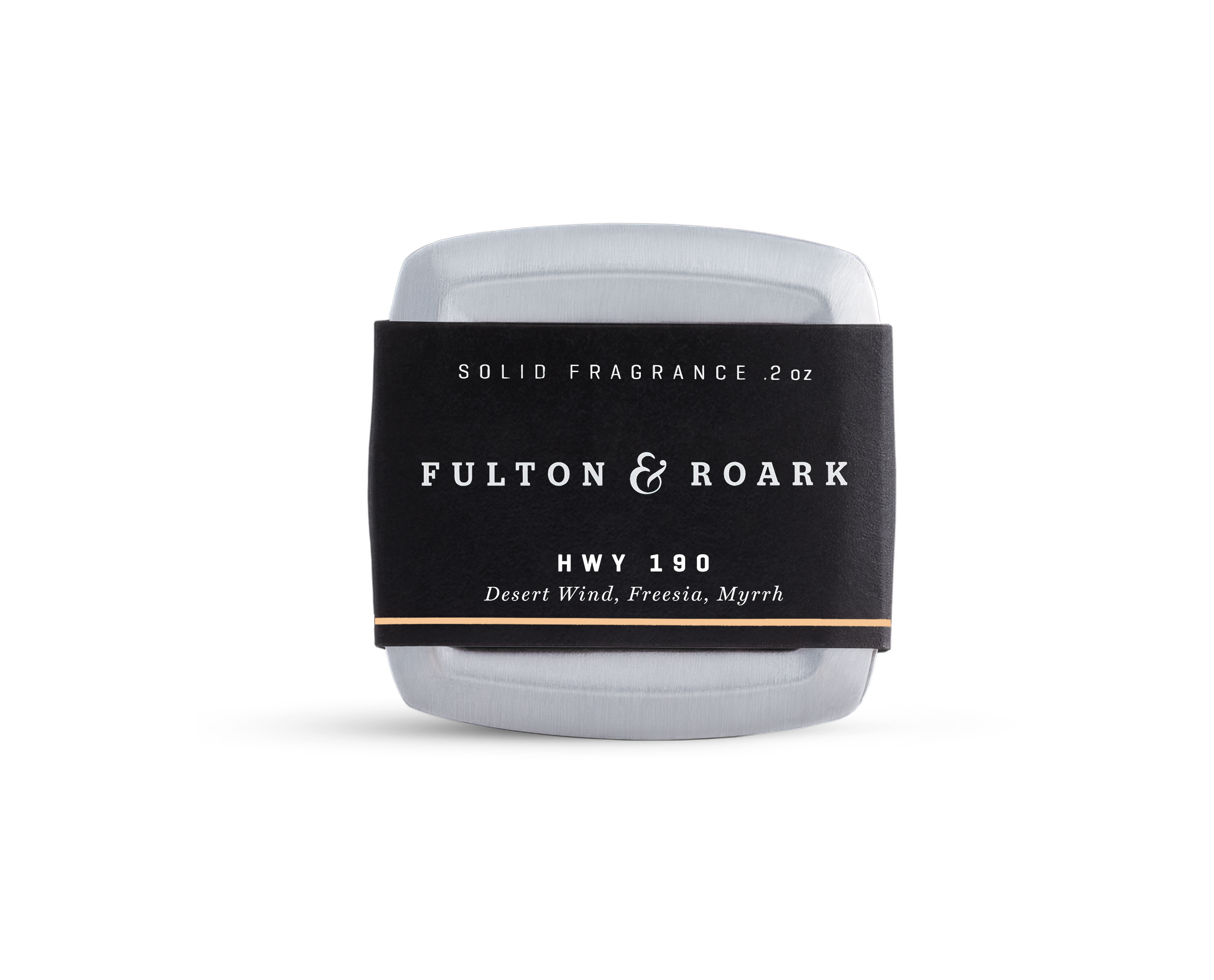 A rectangular metal tin of Fulton & Roark solid fragrance, HWY 190, with a black label featuring the scents Desert Wind, Freesia, and Myrrh. The tin is placed against a plain white background.