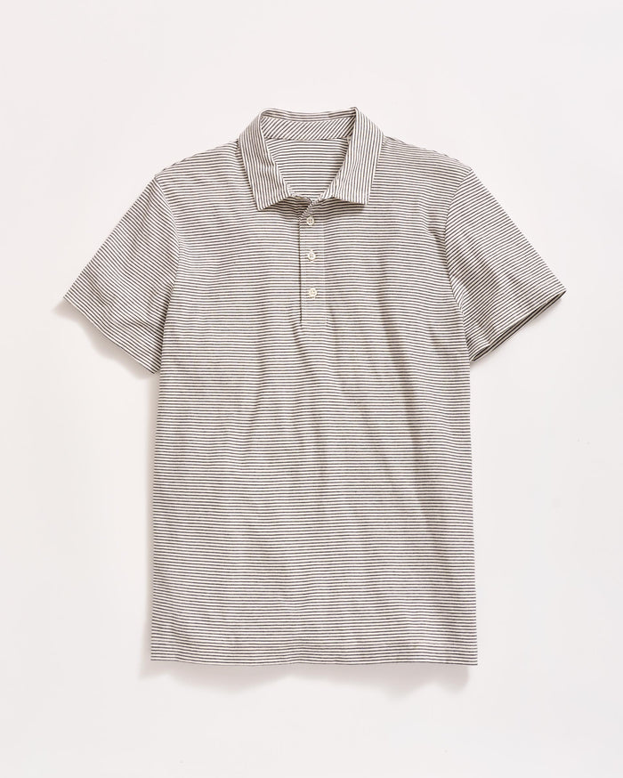 A short-sleeve, light gray polo shirt with thin, horizontal black stripes, a collar, and three buttons down the front, laid flat on a white background.