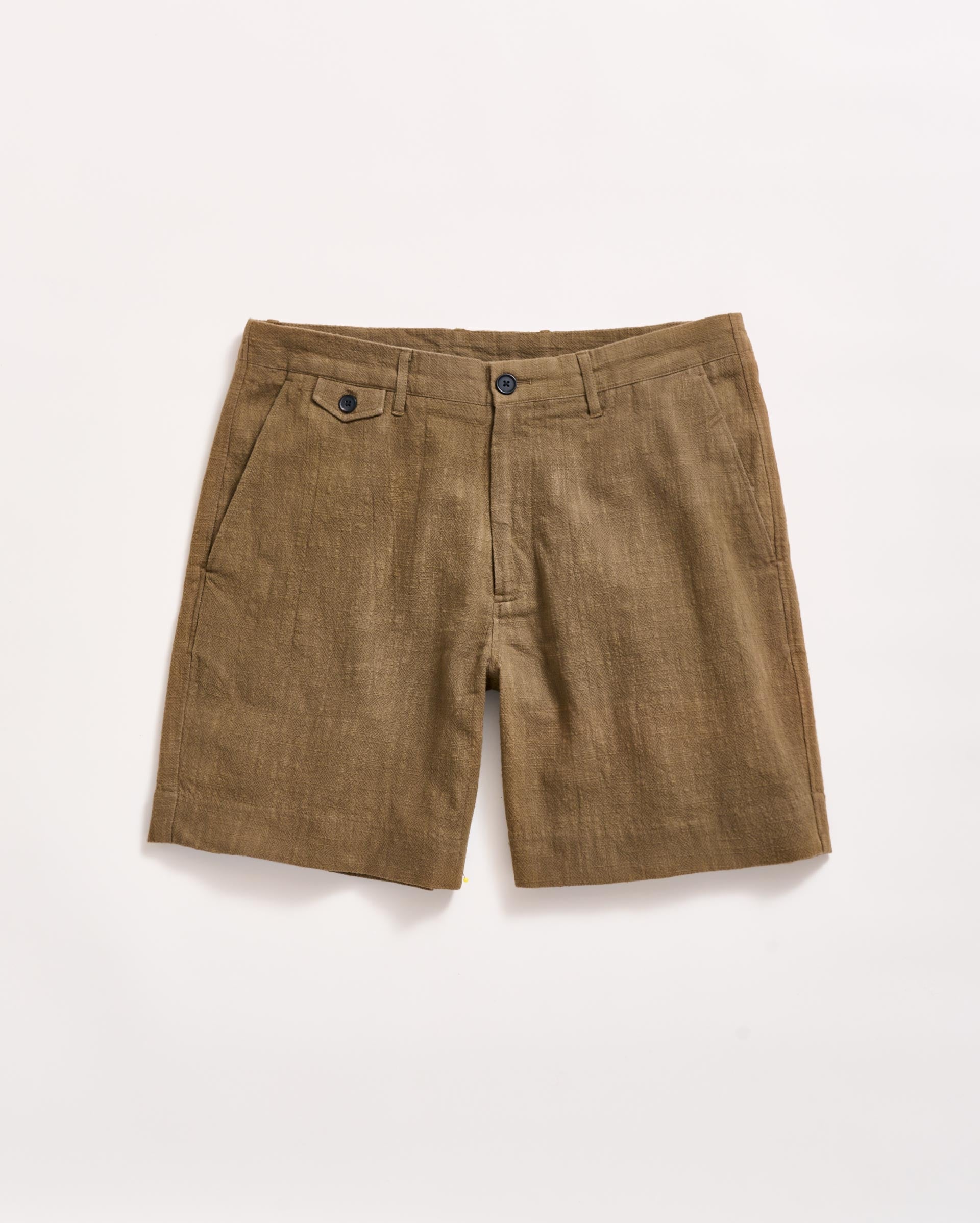 A pair of brown linen shorts with side pockets, belt loops, and a front button and zipper closure, laid flat on a white background.