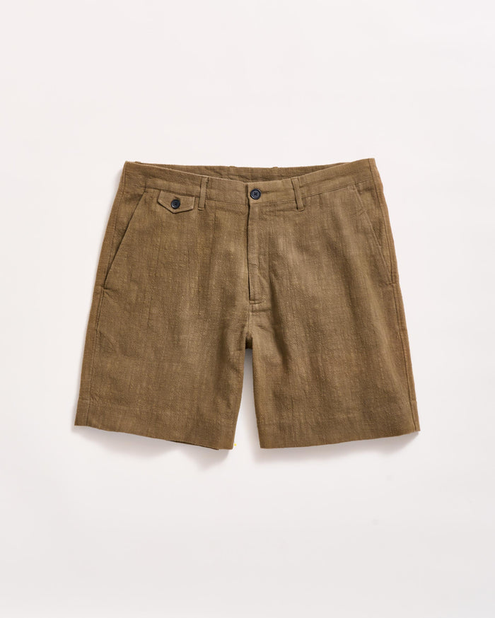 A pair of brown linen shorts with side pockets, belt loops, and a front button and zipper closure, laid flat on a white background.