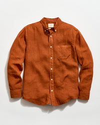 Brown button-up shirt on a white background