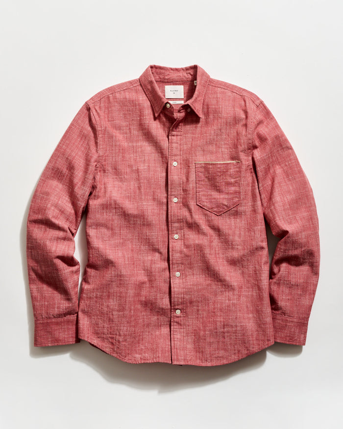 Red button-up shirt on a white background