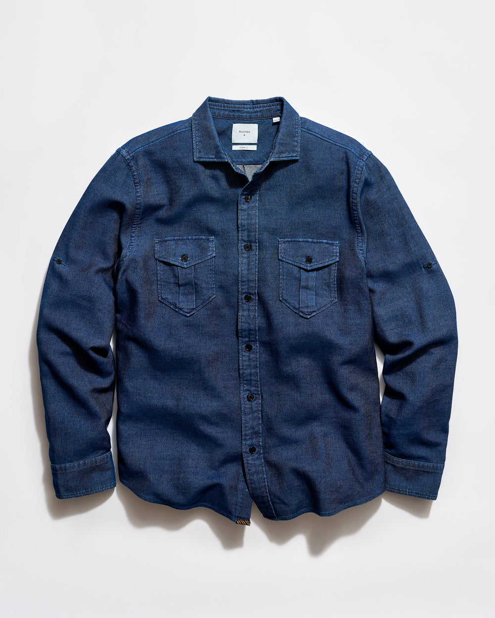 Blue denim shirt on a light gray background