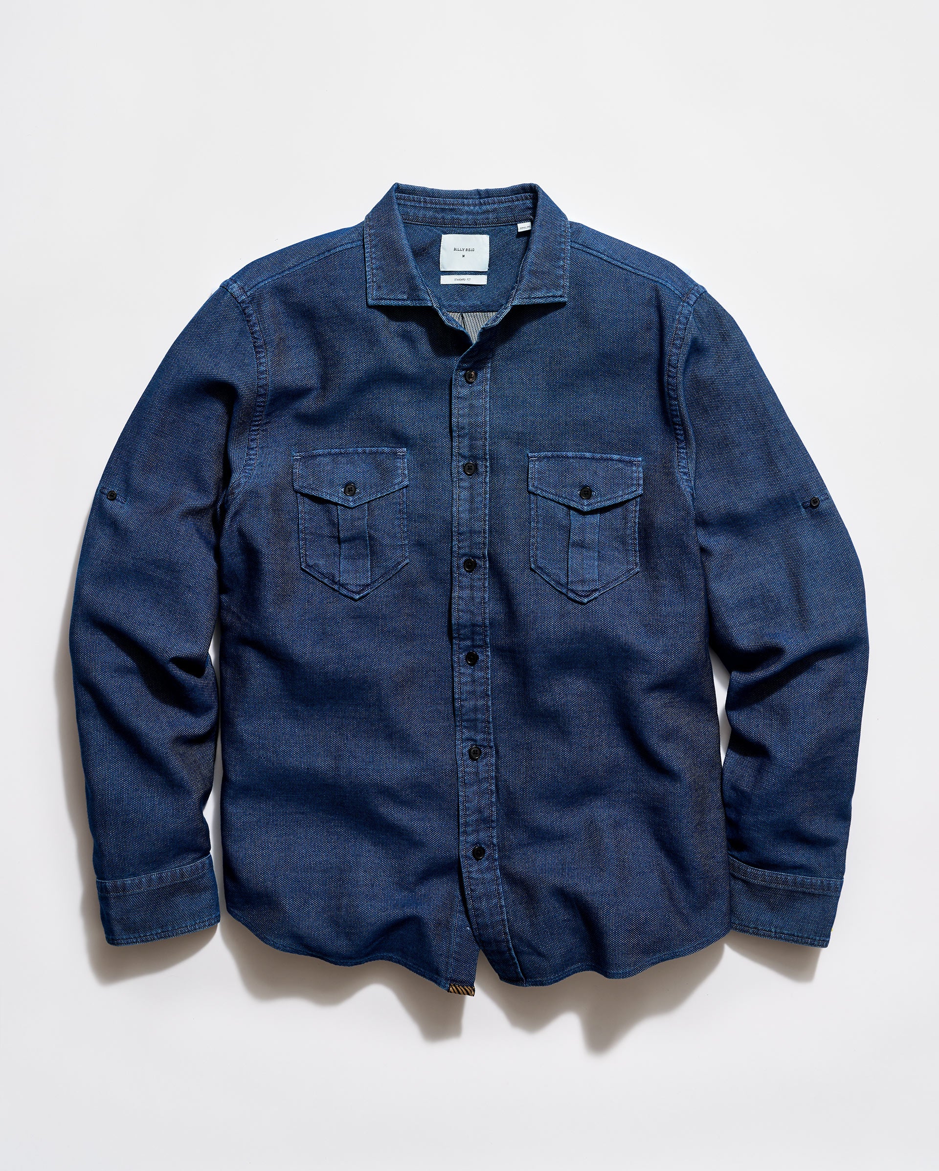 Blue denim shirt on a light gray background