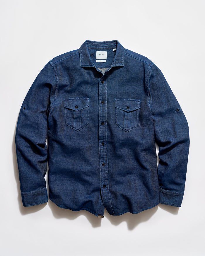 Blue denim shirt on a light gray background