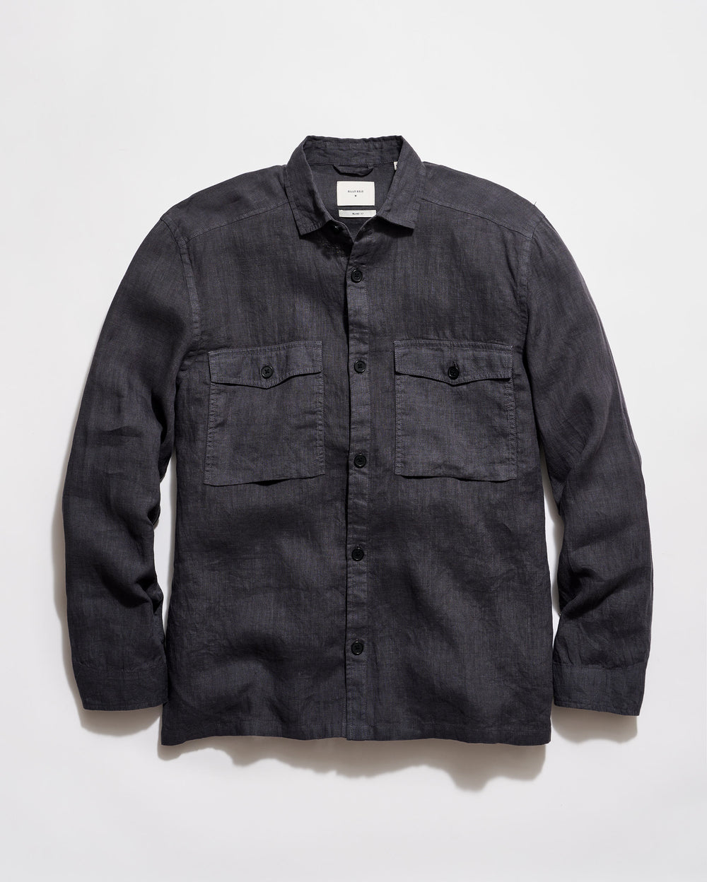 Dark denim shirt with two front pockets on a light gray background