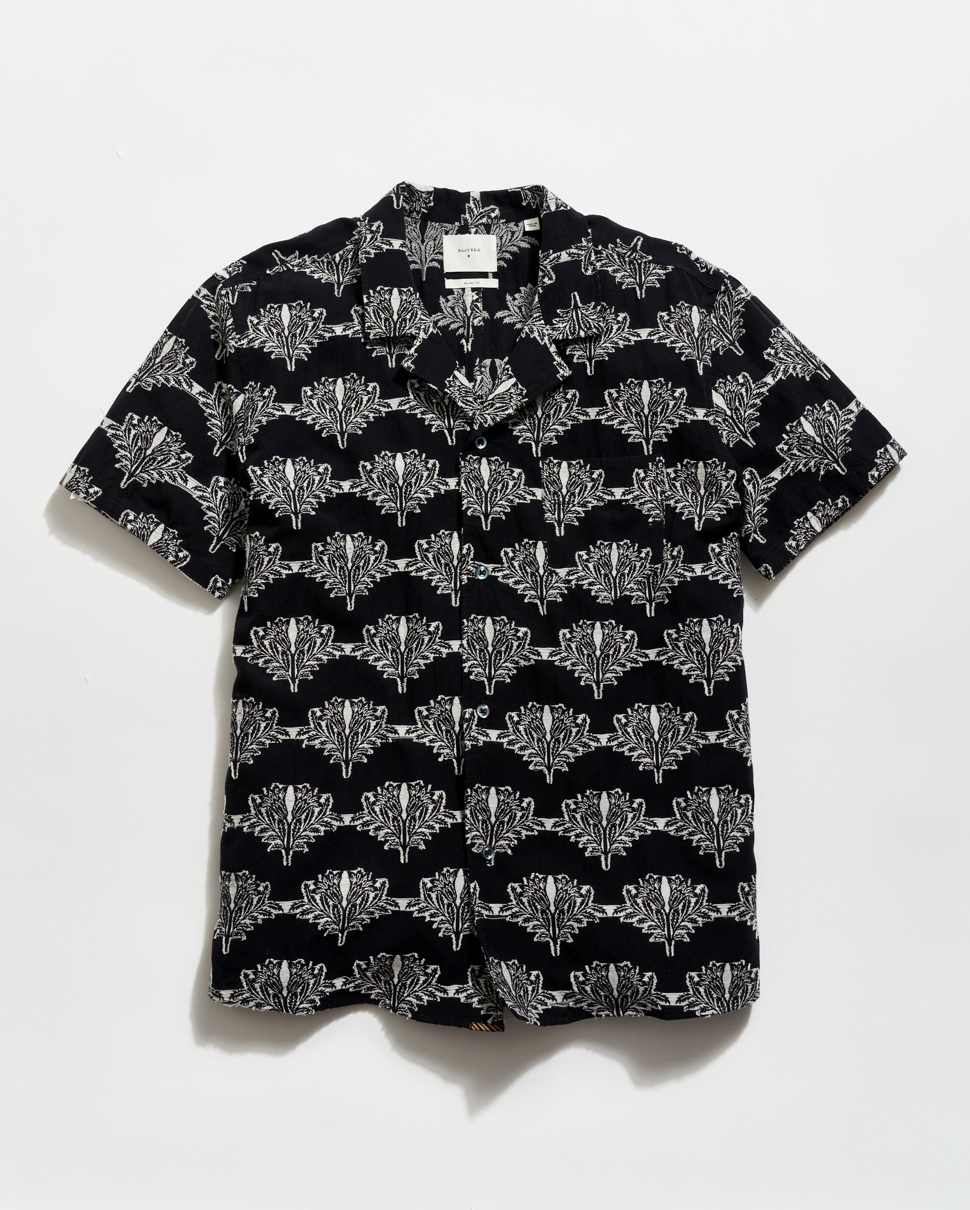 Black shirt with white geometric pattern on a white background