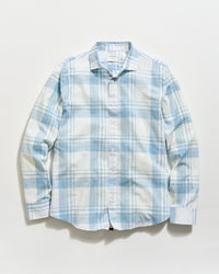 Blue and white plaid shirt on a light gray background