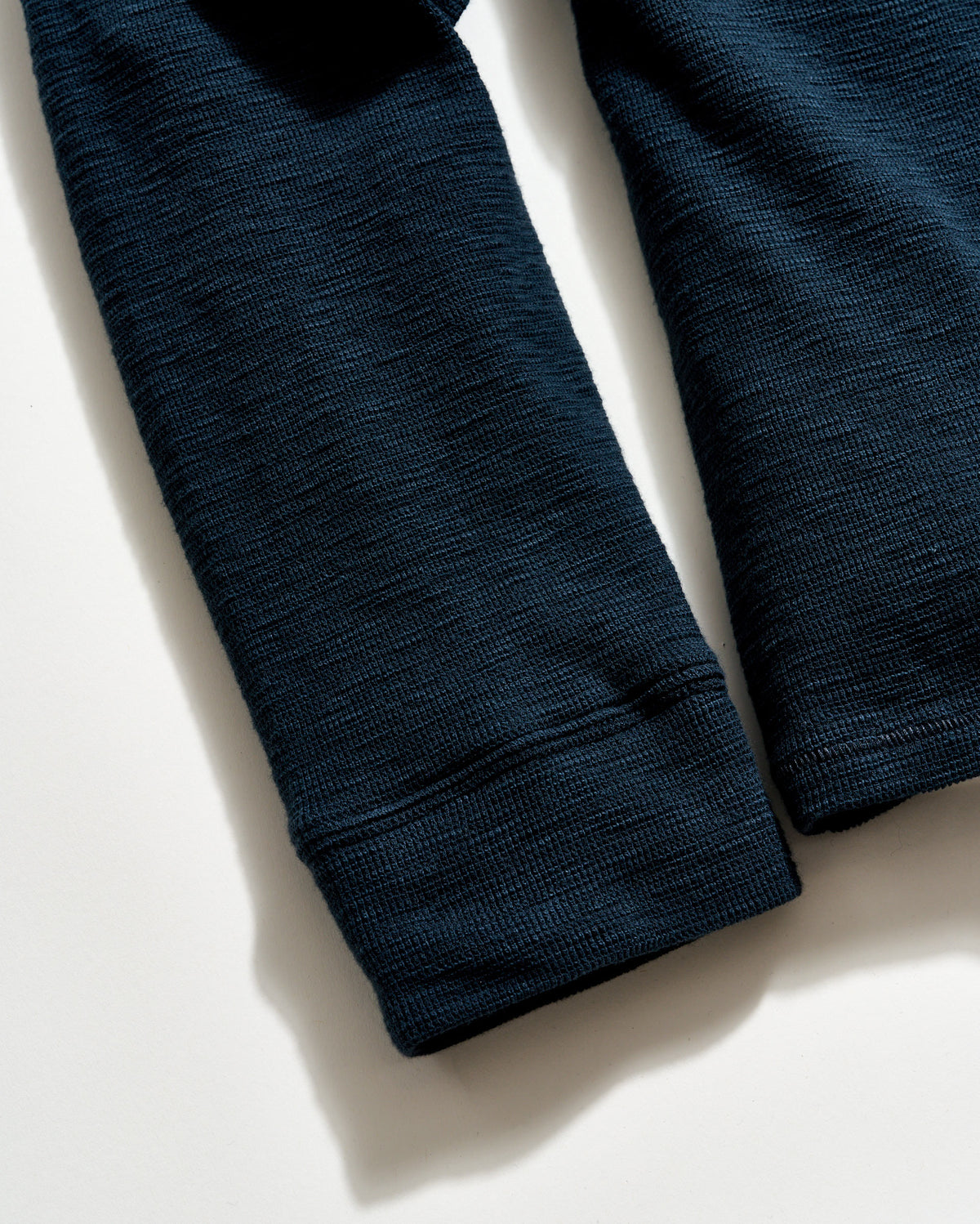 Dark blue textured fabric on a light background