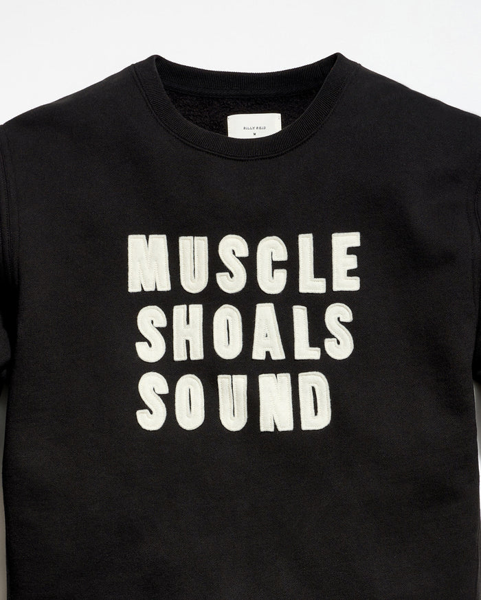Black t-shirt with 'MUSCLE SHOALS SOUND' text on a white background