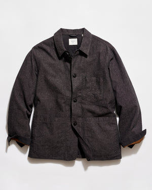 Dark gray jacket with button details on a light gray background