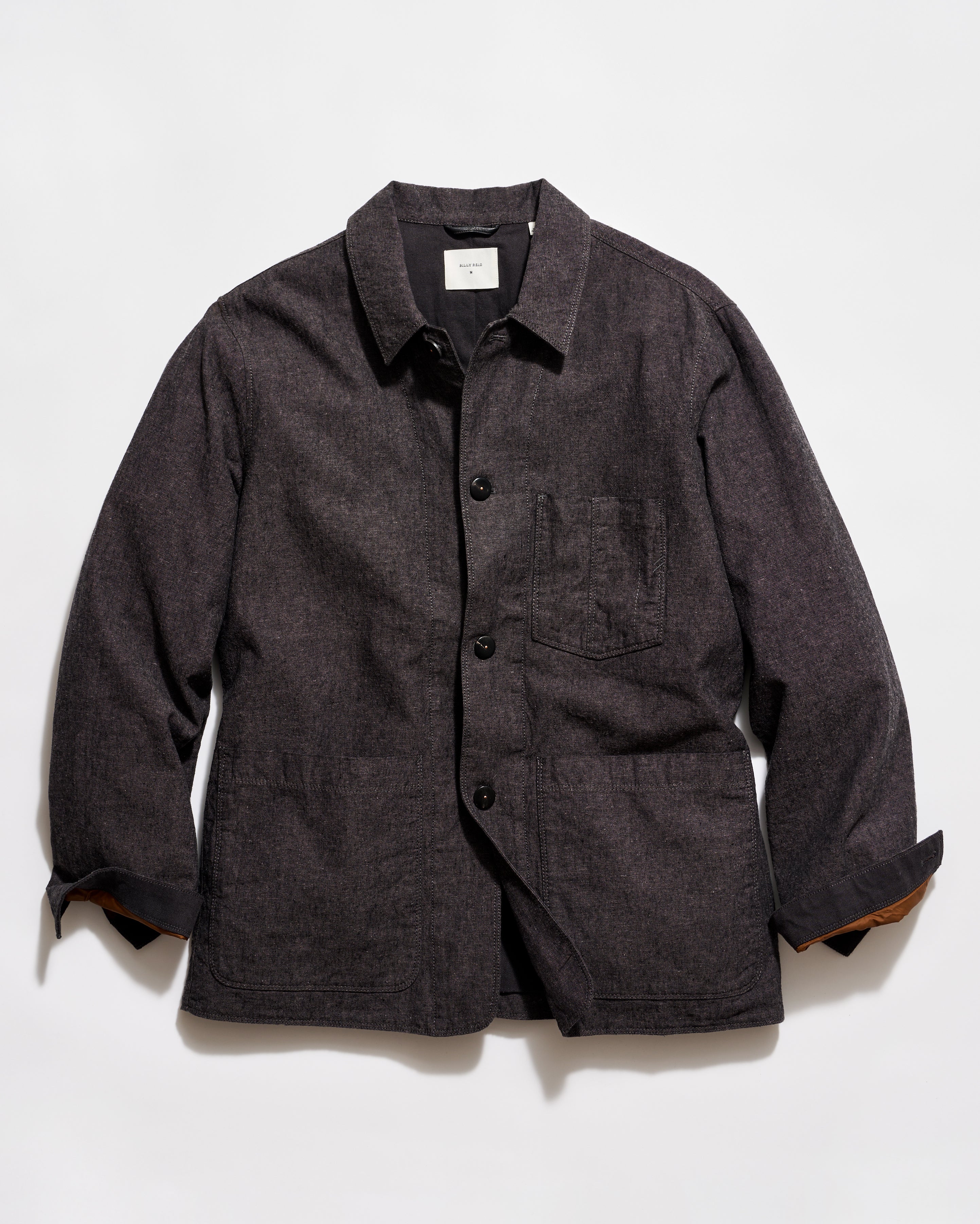 Dark gray jacket with button details on a light gray background