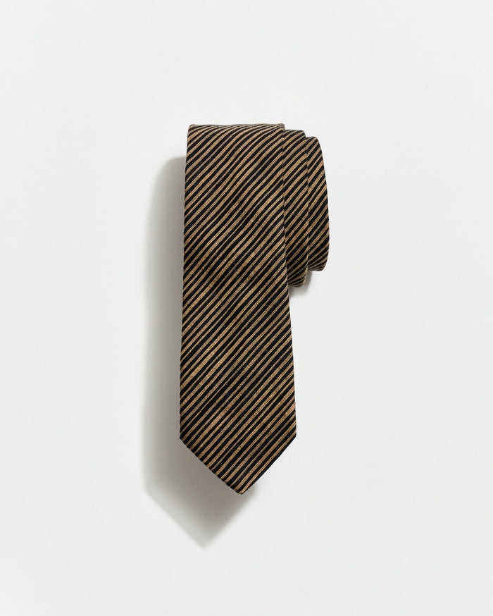 Striped tie on a light gray background