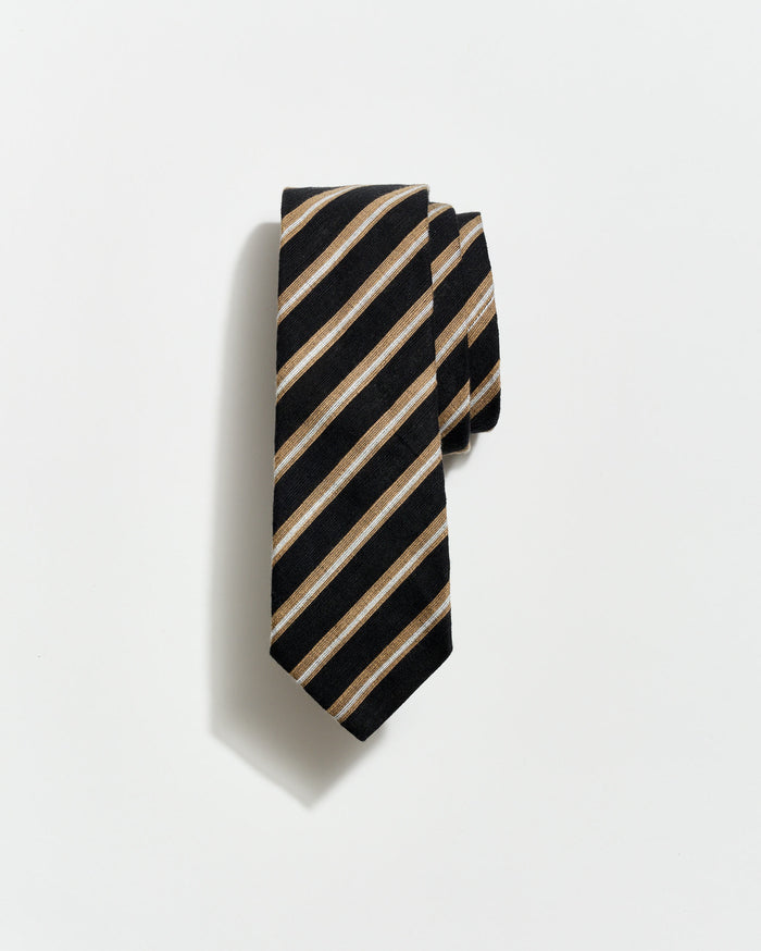 Black and beige striped tie on a light gray background