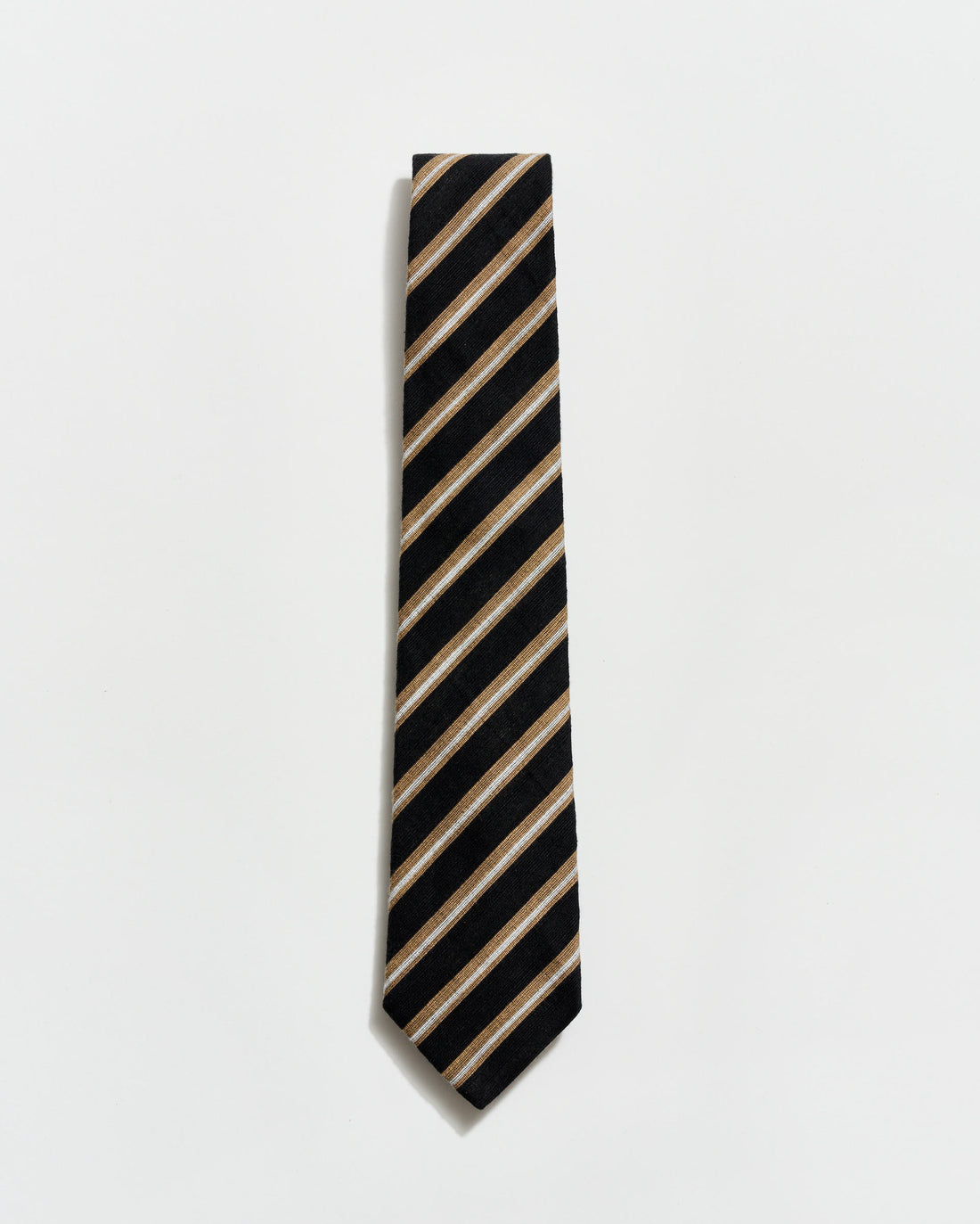 Black and beige striped tie on a light gray background