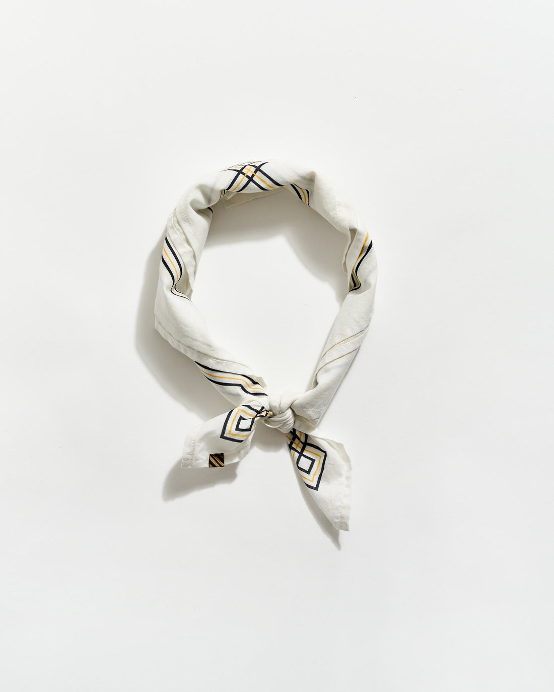 White bandana with black geometric patterns on a white background