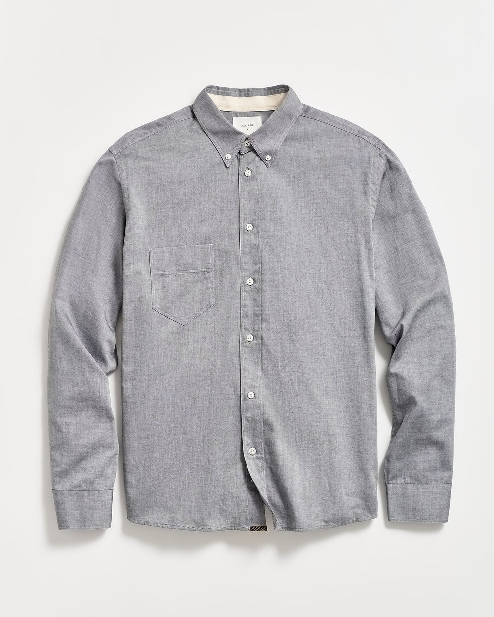 A light gray, long-sleeve button-down shirt with a single chest pocket, buttoned collar, and white buttons, laid flat on a white background.